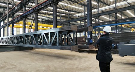 we received a visit from a Spanish client to discuss a steel structure project for a three-story warehouse in Spain